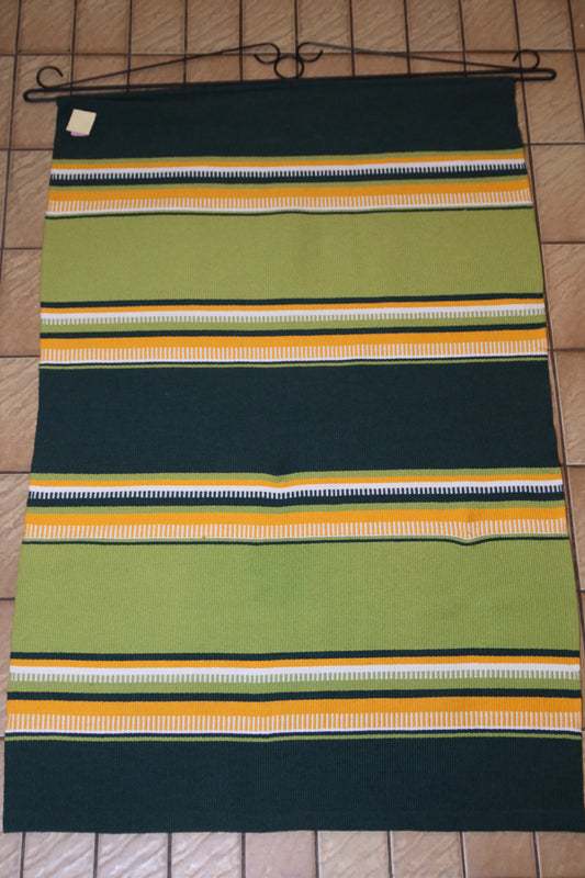 Seinävaate kelta-vihreä