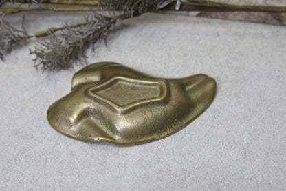 Messinkinen tuhkakuppi